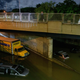 Floodwater surrounds vehicles following heavy rain on an expressway in Brooklyn, New York early on September 2, 2021, as flash flooding and record-breaking rainfall brought by the remnants of Storm Ida swept through the area.